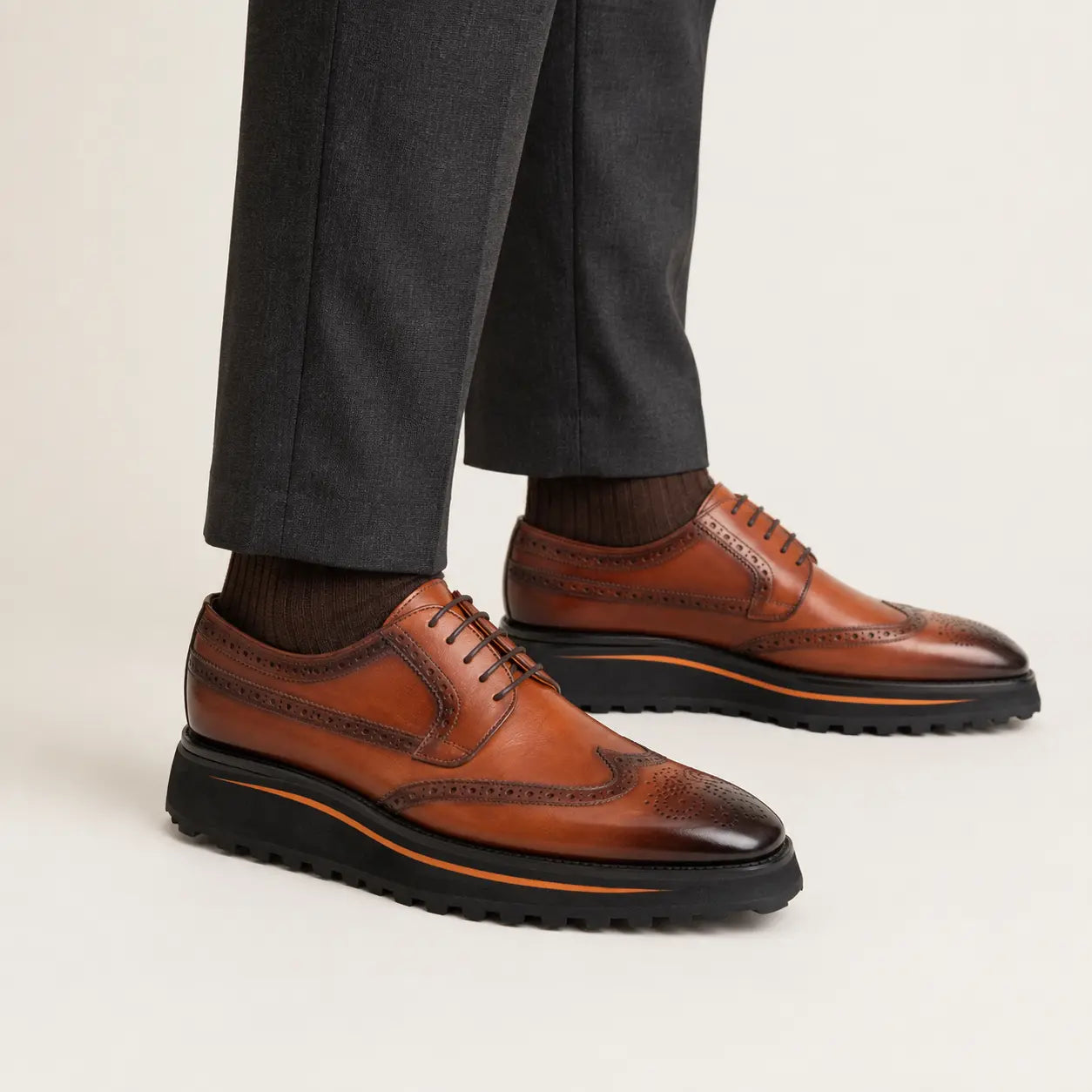 Antique walnut wingtip platform Derby shoes on foot