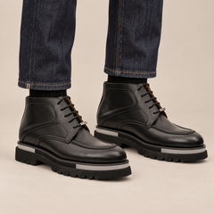 DIVINCH black glossy apron-toe ankle boots worn with raw indigo denim