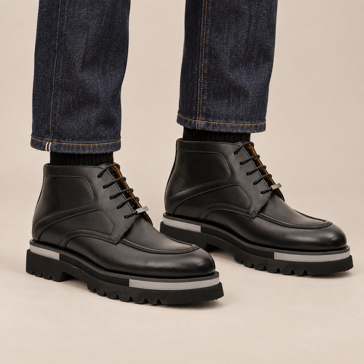 DIVINCH black glossy apron-toe ankle boots worn with raw indigo denim