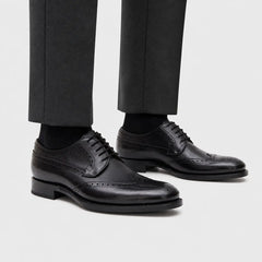 Black Brogue Derby Shoe on-foot studio view