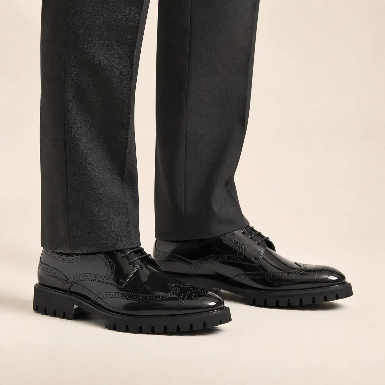 DIVINCH black patent brogue derby shoes with lug sole — on-foot studio view