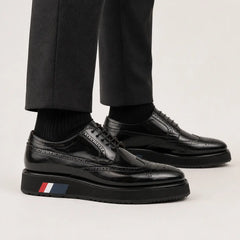 Black brogue Derby with black sole on foot
