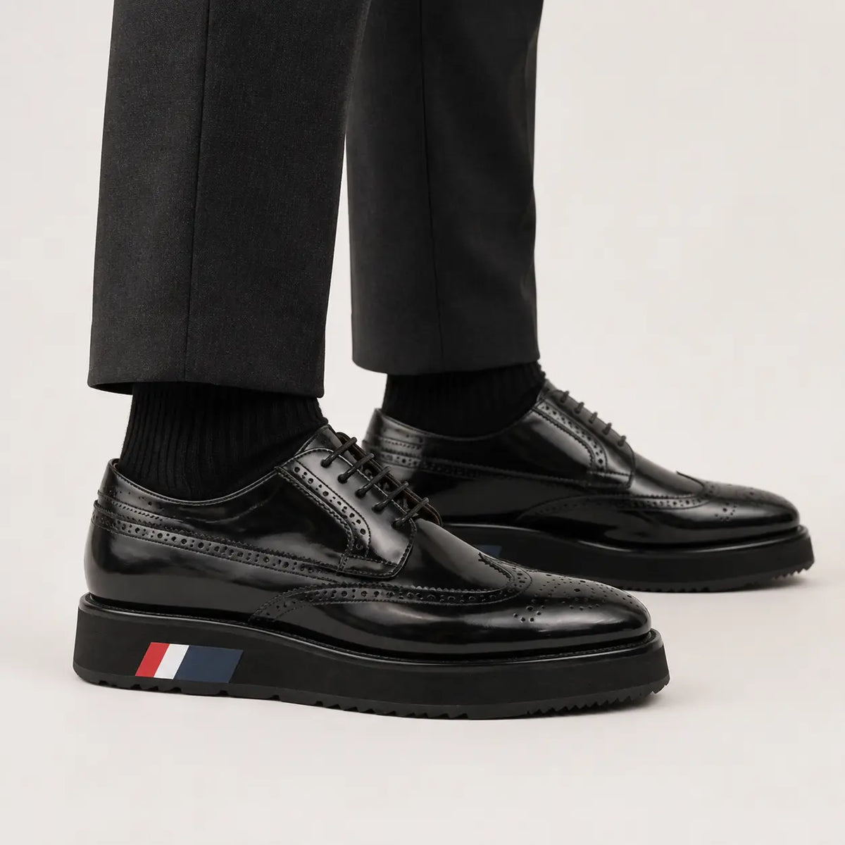 Black brogue Derby with black sole on foot
