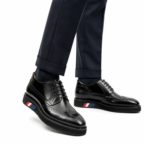 Bottes de combat à plateforme broguées en simili-cuir noir