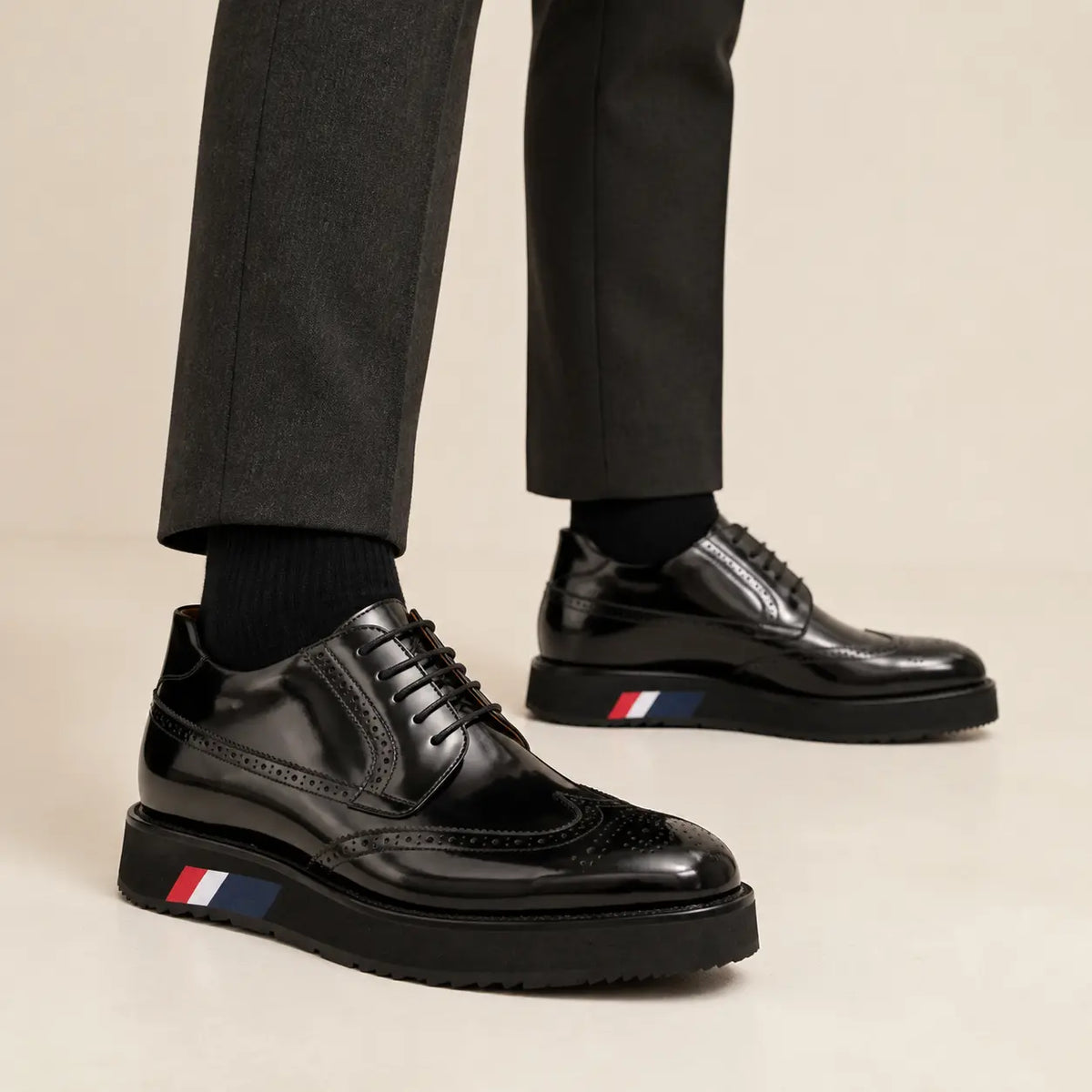 DIVINCH black brogue platform bootie on foot