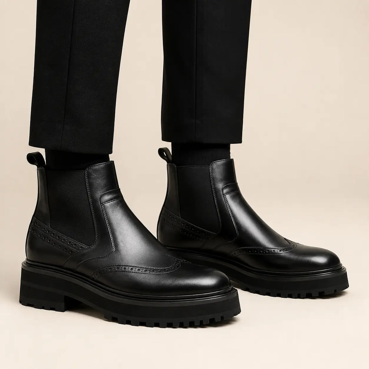 Black Brogued Chelsea Boots with Lug Sole — on-foot studio view