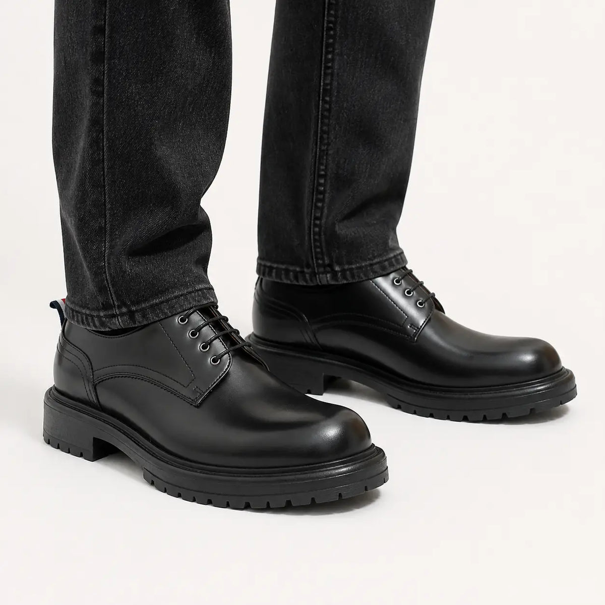 Black Big Toe Lug Derby — on-foot studio view