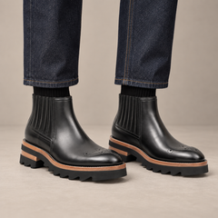 Black Round-Toe Chelsea Boots with Ribbed Panels — DIVINCH hero image