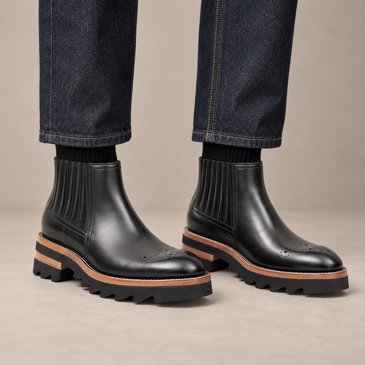 Black Round-Toe Chelsea Boots with Ribbed Panels — DIVINCH hero image