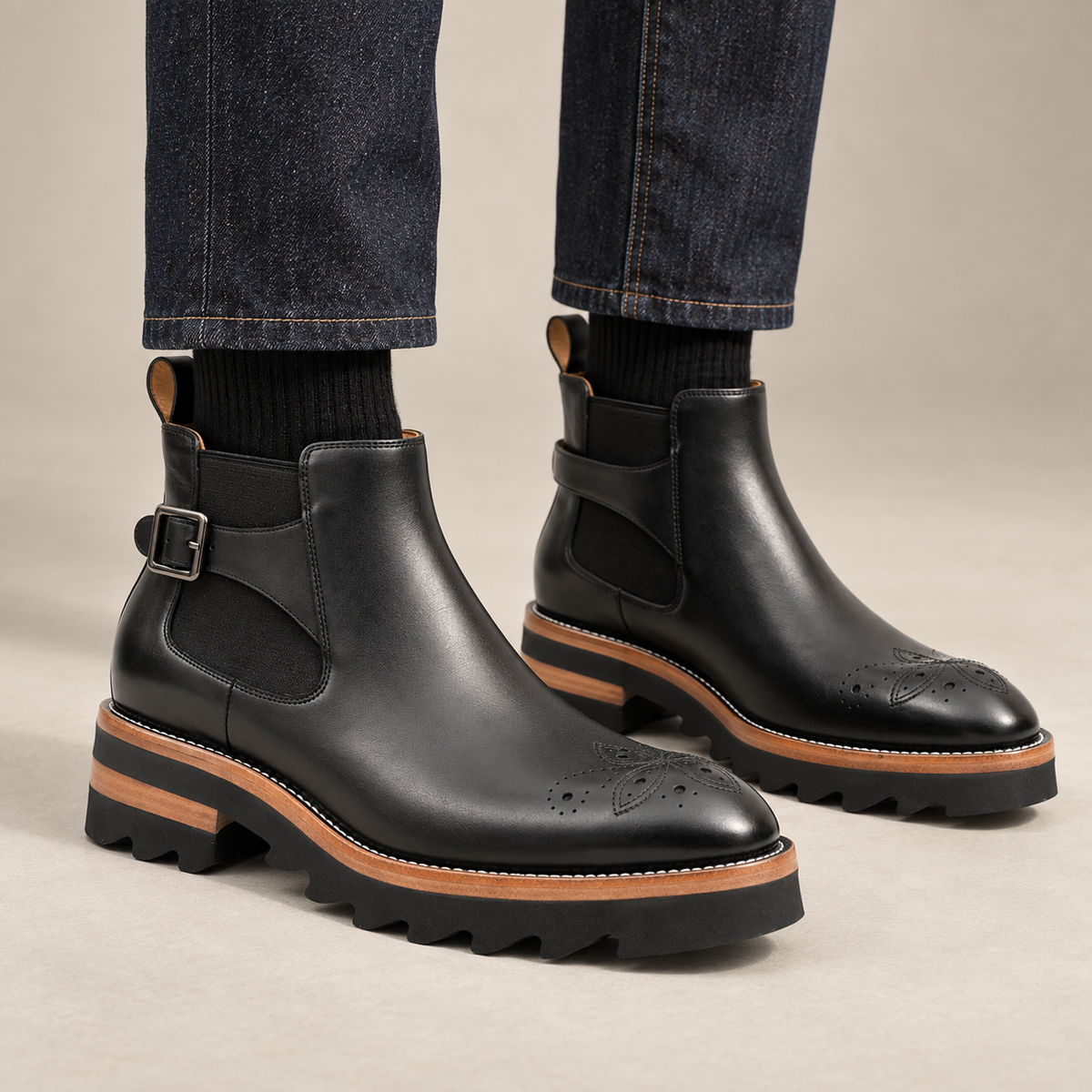Black round-toe Chelsea boots with ankle buckle on model lower legs, DIVINCH 7002B