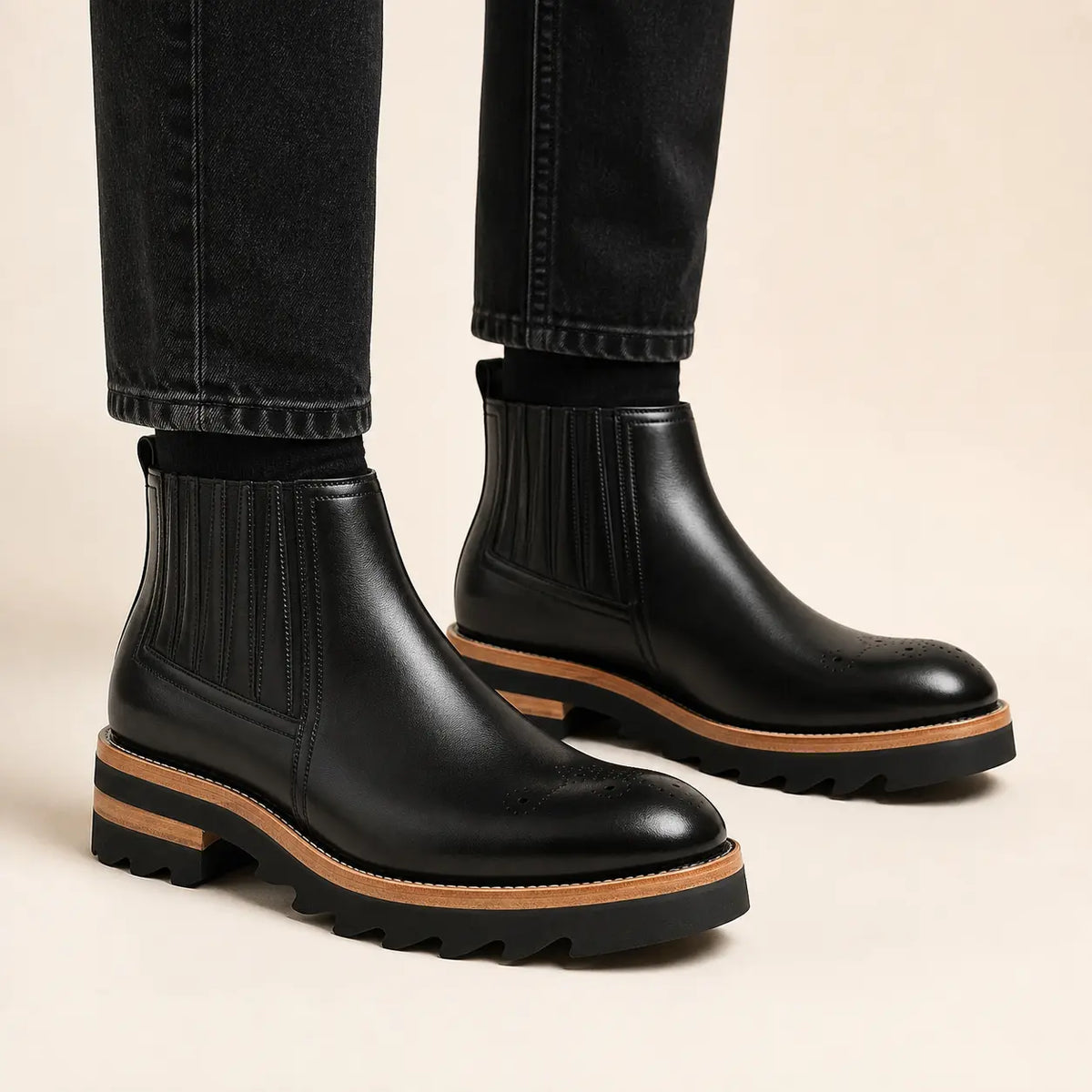 Black Chelsea Boots with Ribbed Panels — on-foot studio view