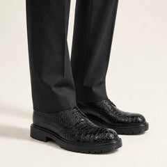 Black Croc-Embossed Derby on foot, warm off-white studio