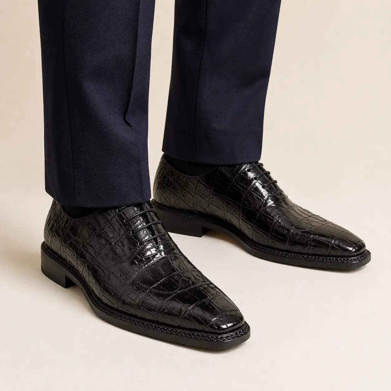 DIVINCH black crocodile Norwegian Oxford shoes on foot with navy trousers