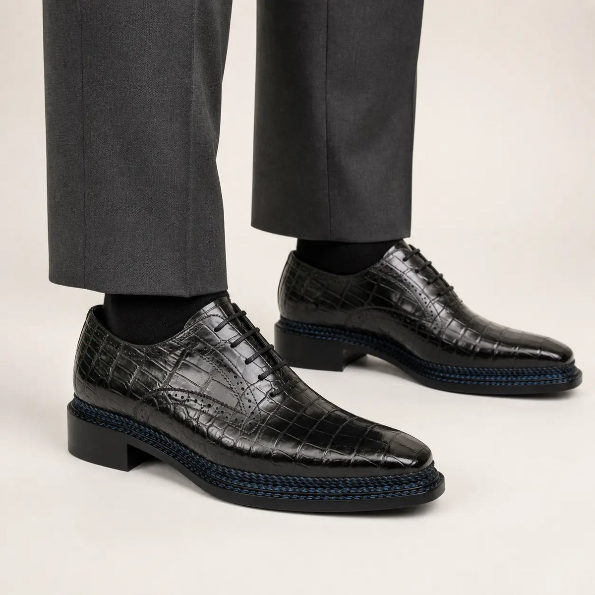 DIVINCH black crocodile Oxford with blue-black Norwegian welt on foot — warm studio side profile