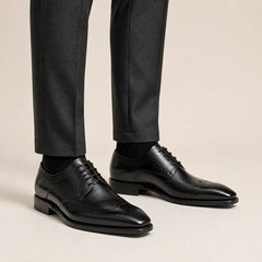 Black Goodyear Wingtip Derby — on-foot studio view