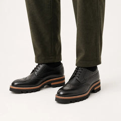 DIVINCH Black Lug Sole Brogue Derby — on-foot studio view