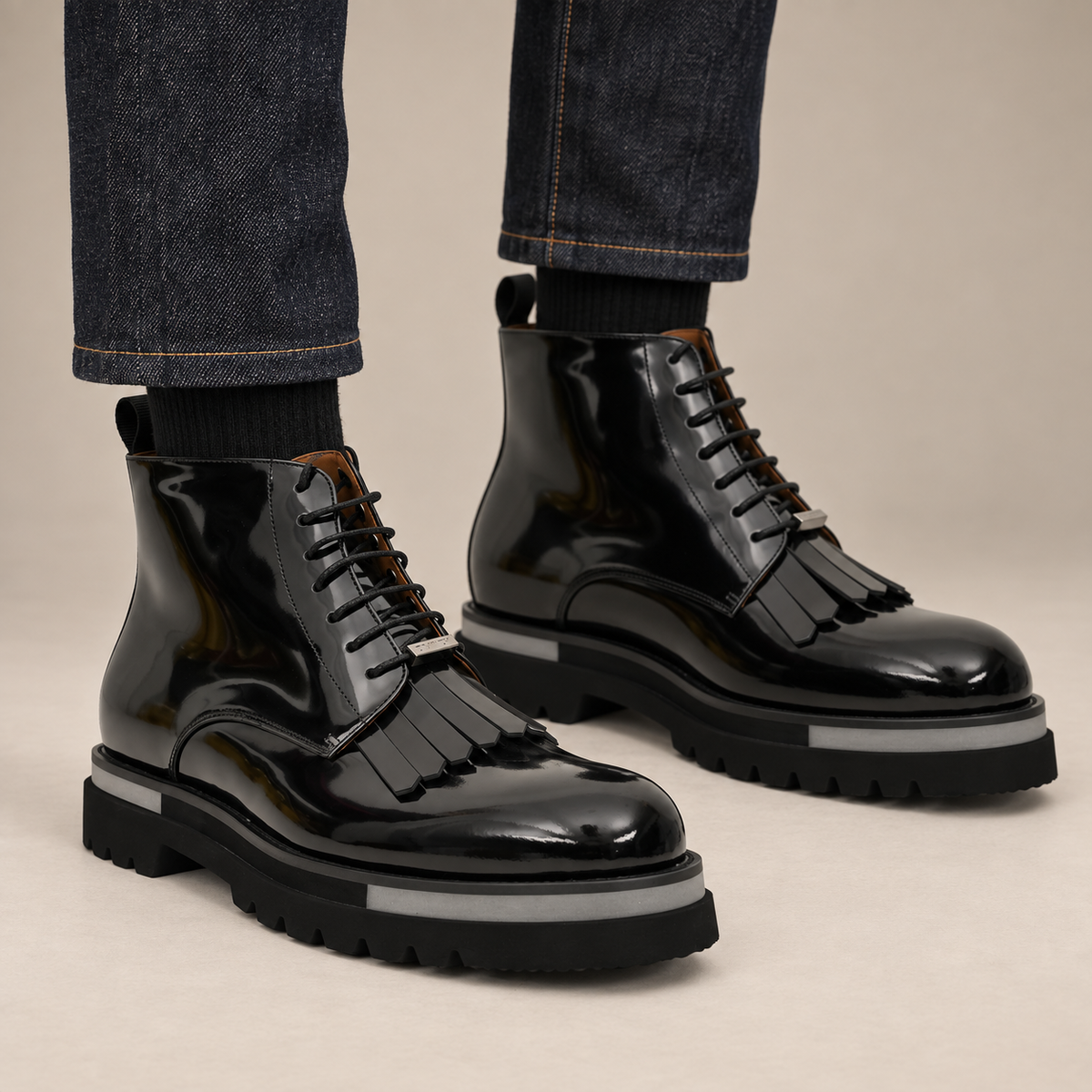 DIVINCH black glossy plain-toe fringe ankle boots worn with raw indigo denim