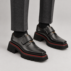 Black platform square-toe strap shoes on foot
