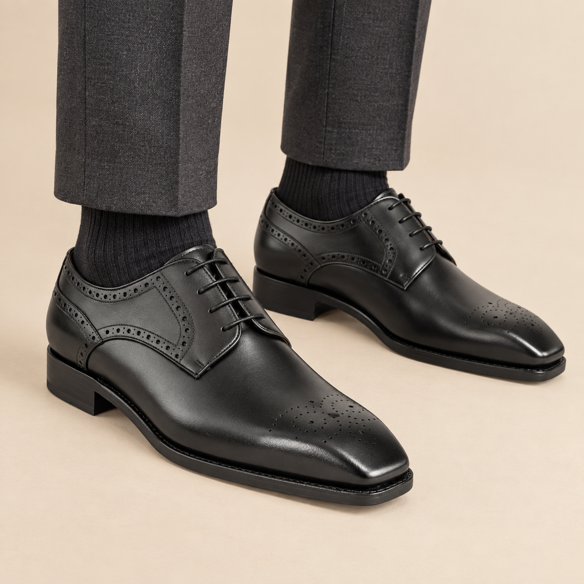 Black square-toe Oxfords with perforated collar trim on model
