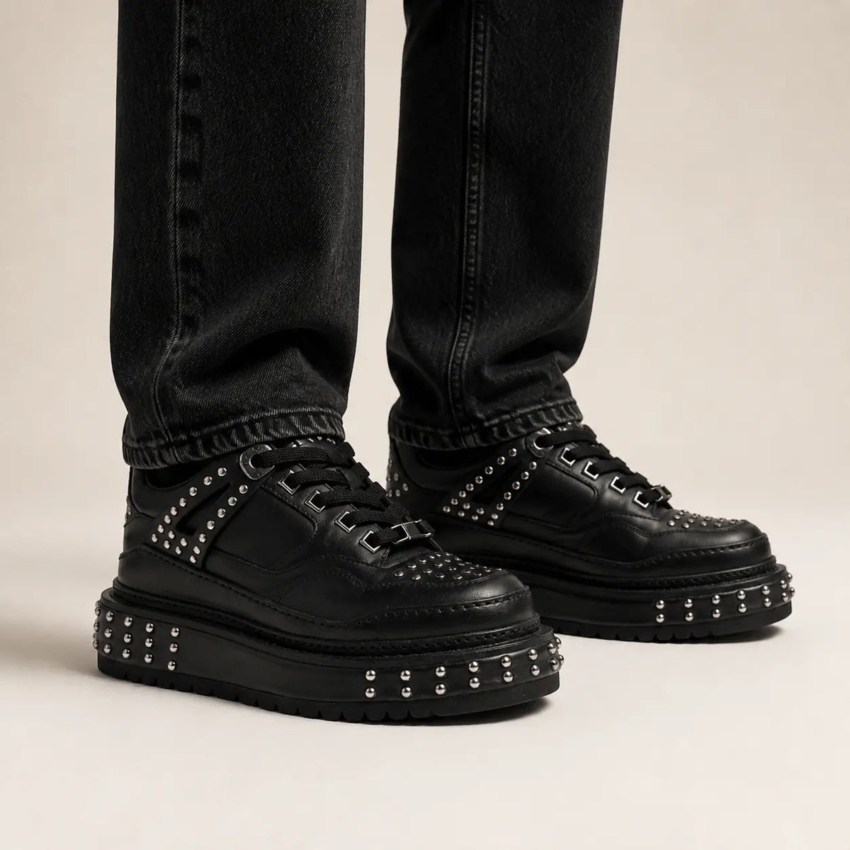 Black Studded Platform Sneaker — on-foot studio view