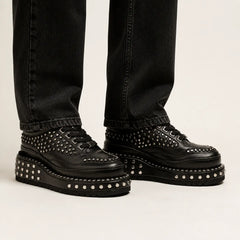 Black Heavy Studded Platform Sneaker — on-foot studio view