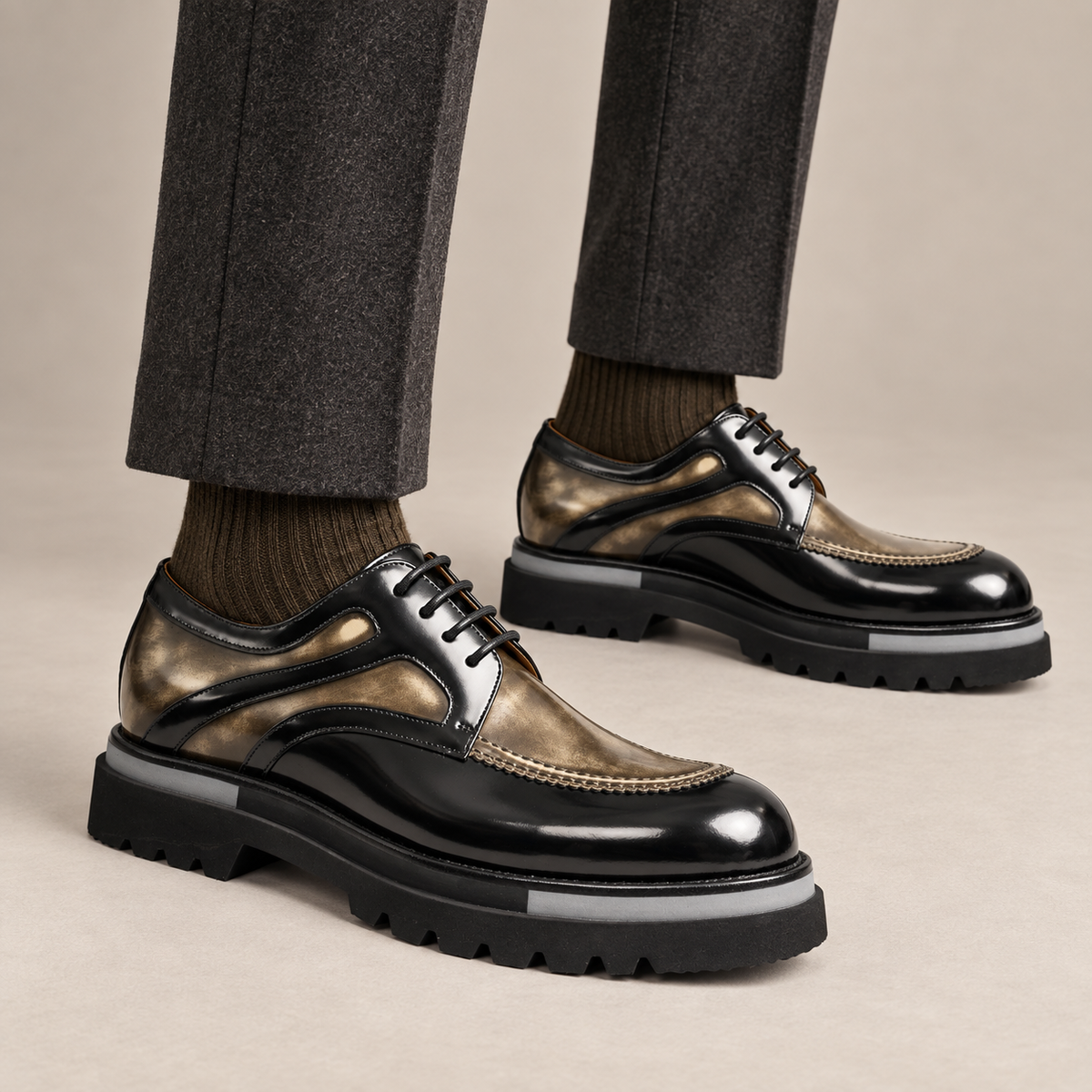 Black and bronze-gold layered-panel Derby shoes — on-foot studio view