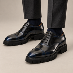 DIVINCH blue-shaded black glossy lug-sole cap-toe Oxford shoe on foot