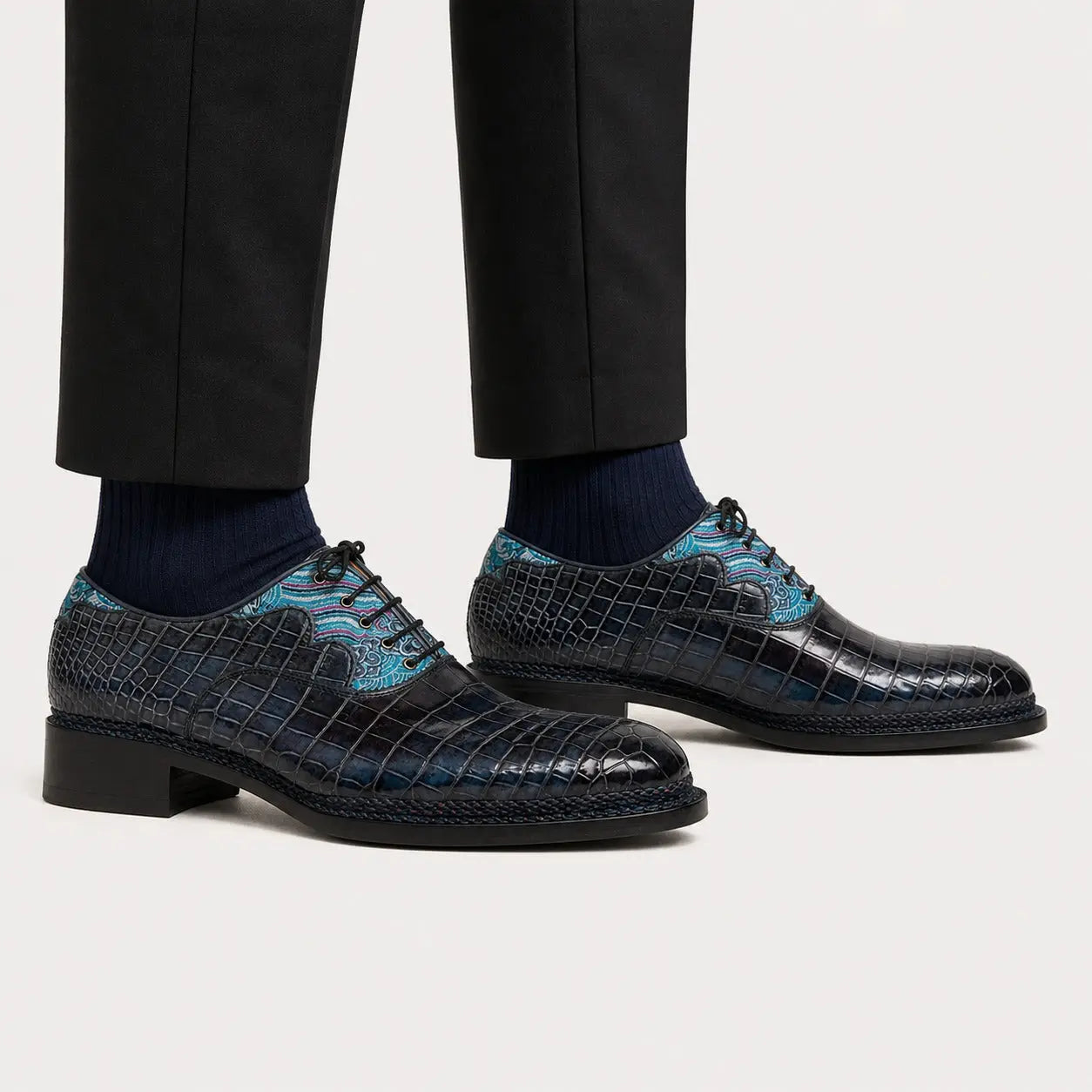 Blue pattern crocodile Oxford shoes worn with black trousers and navy socks