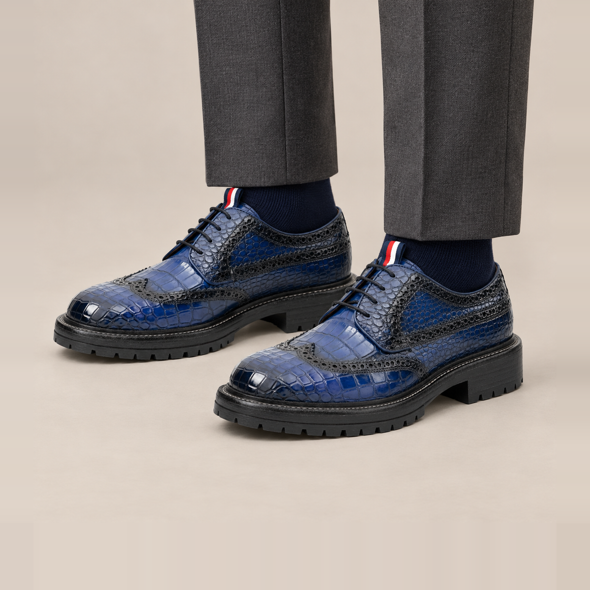 Blue Textured Wingtip Derby Shoes with Tongue Tab — on-foot studio view