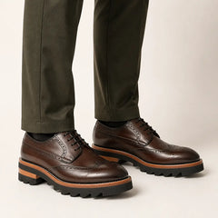 Brown Brogue Lug Derby — on-foot studio view