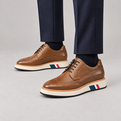 Brown brogue Derby shoes with contrast platform sole — premium on-foot studio view