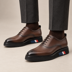 Brown platform plain-toe lace-up shoes — balanced on-foot studio view