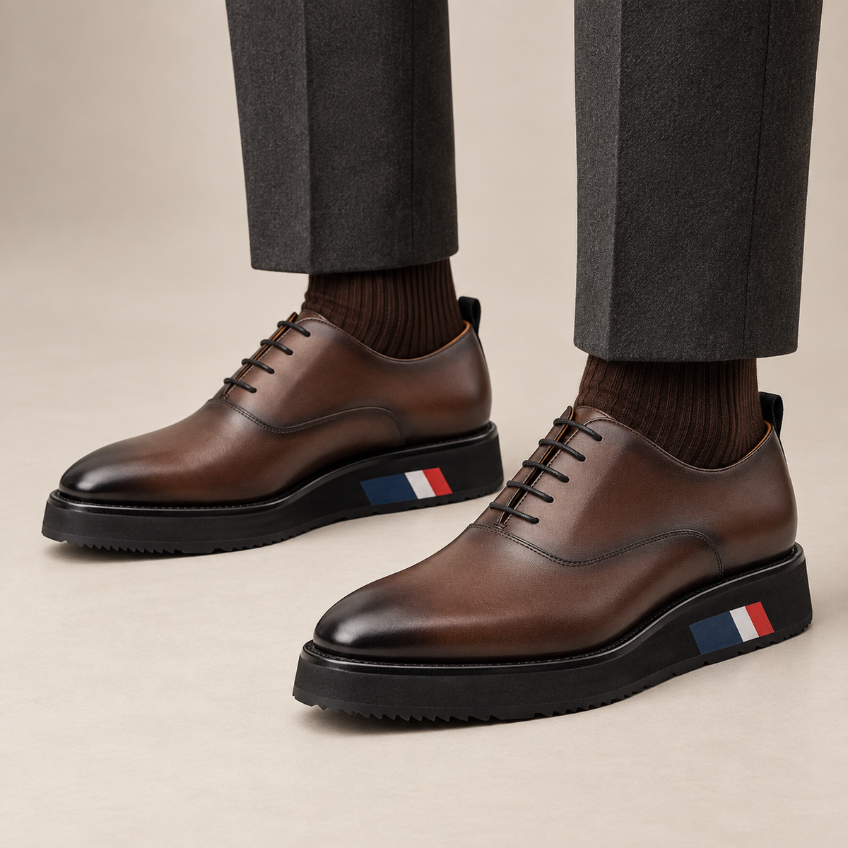 Brown platform plain-toe lace-up shoes — balanced on-foot studio view