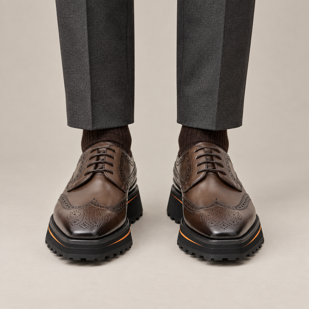 Brown Perforated Wingtip Derby Shoes with Brown-Edge Lug Sole — DIVINCH hero image, parallel stance