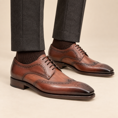 Brown calfskin wingtip Derby shoes with low brown heel on model lower legs, DIVINCH 2896A-SG