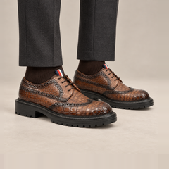 Brown Scale-Pattern Wingtip Derby Shoes with Lug Sole — on-foot studio view