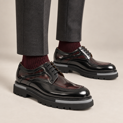 Black and burgundy layered-panel Derby shoes — on-foot studio view