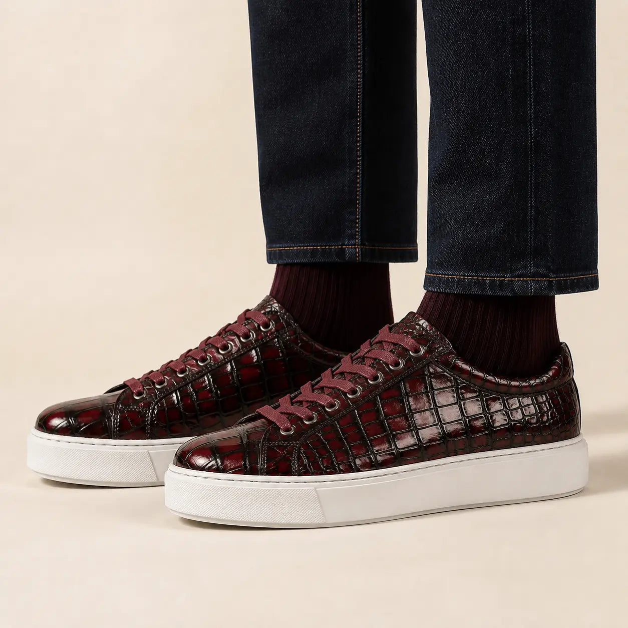 Burgundy crocodile court sneakers on foot