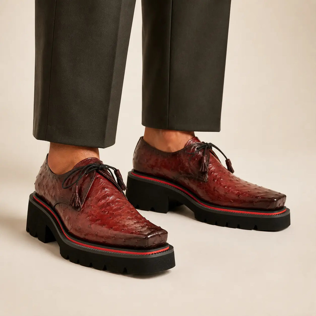 Burgundy ostrich lug Derby worn with deep olive-charcoal wide-leg trousers