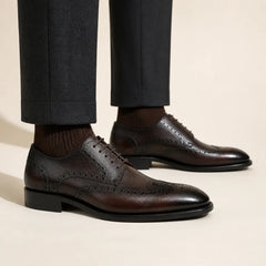 DIVINCH burnished brown wingtip Derby on foot — warm studio side profile