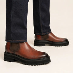 Burnished Chelsea Lug Boot worn with raw indigo denim
