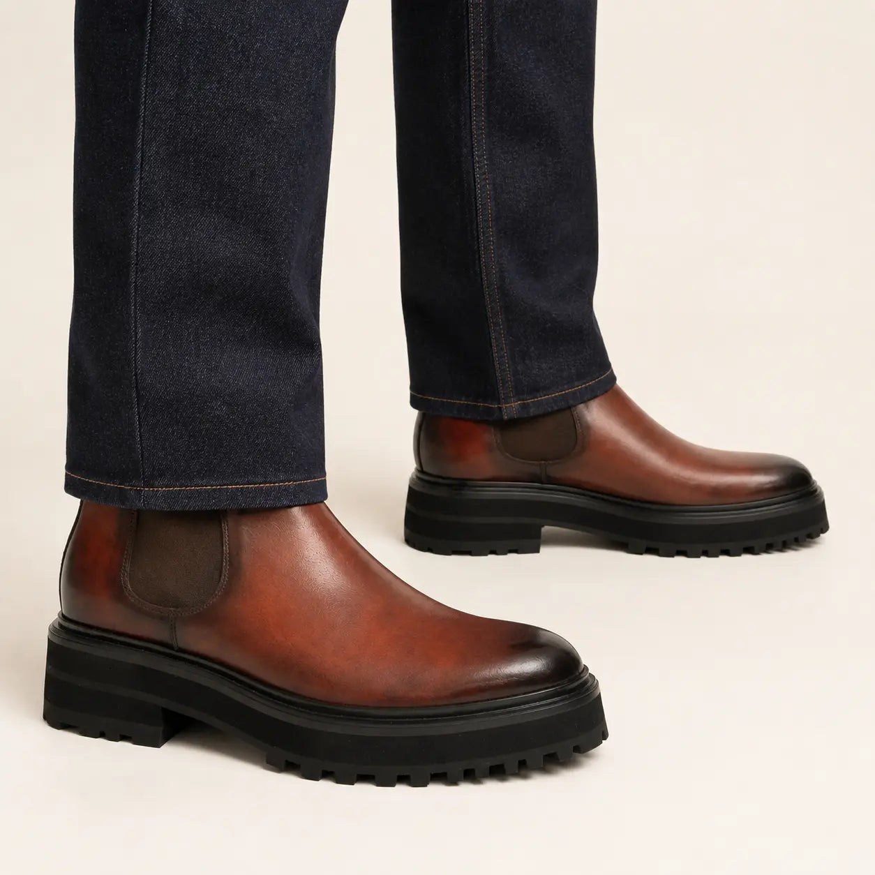 Burnished Chelsea Lug Boot worn with raw indigo denim