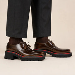 Burnished dark brown square-toe lug Derby on foot