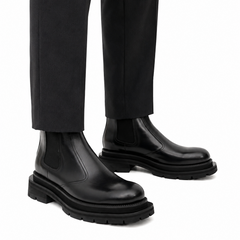 Bottines Chelsea noires à brogues avec semelle à crampons