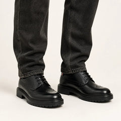 Black Chunky Brogue Derby — on-foot studio view