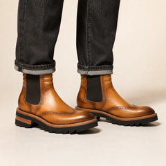Cognac lug sole Chelsea boot on foot in studio