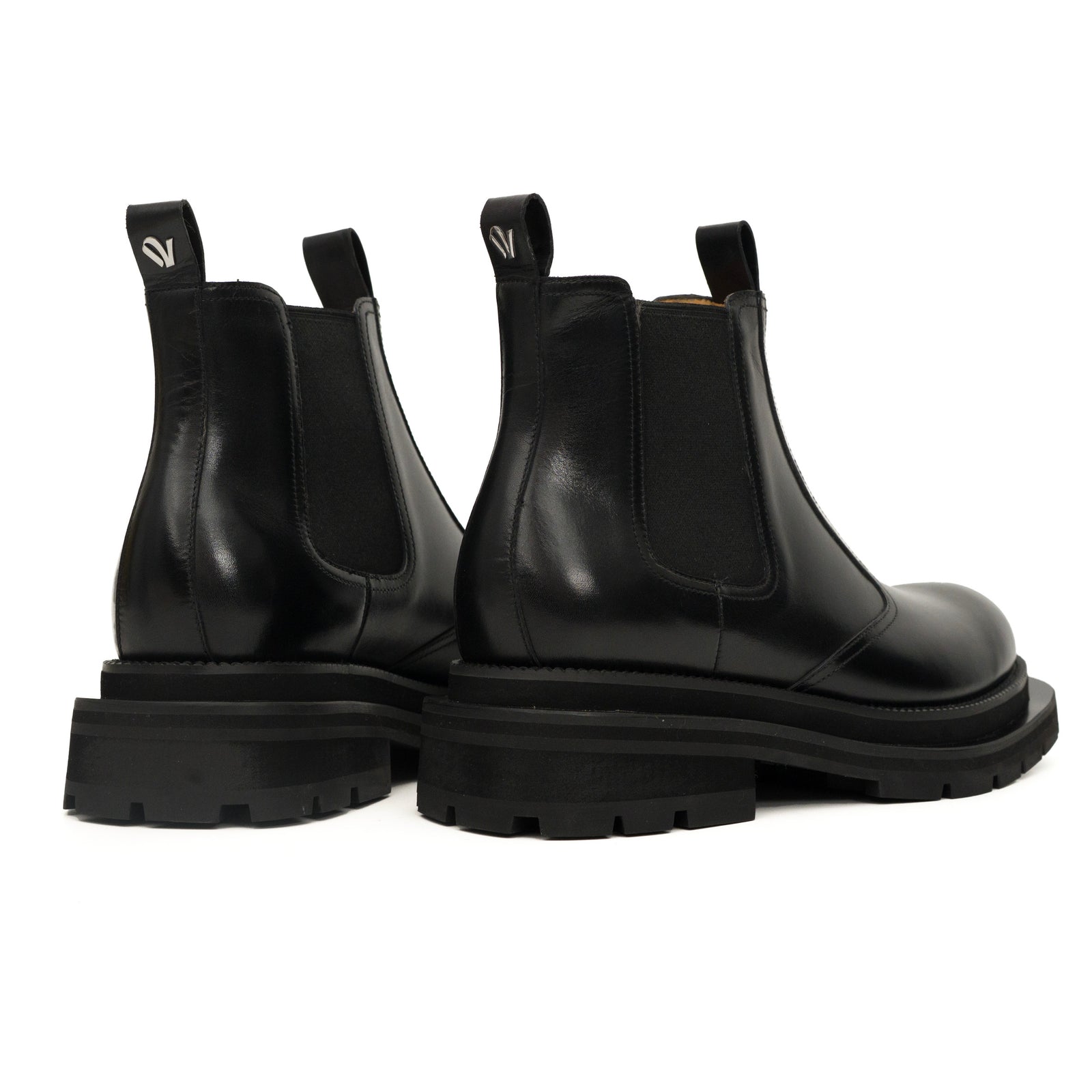 Bottines Chelsea noires à brogues avec semelle à crampons