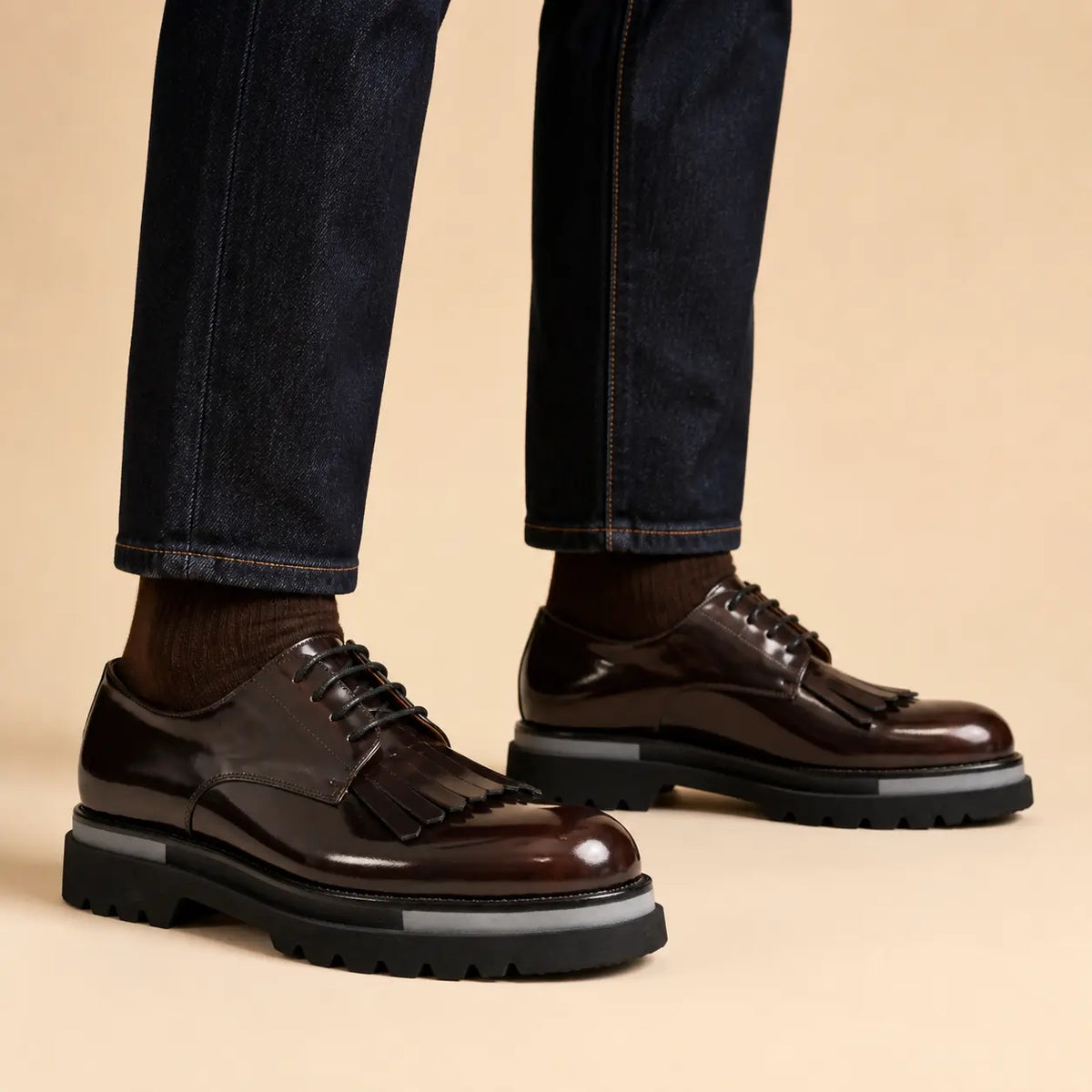 DIVINCH dark brown polished kiltie lug Derby shoes worn on foot