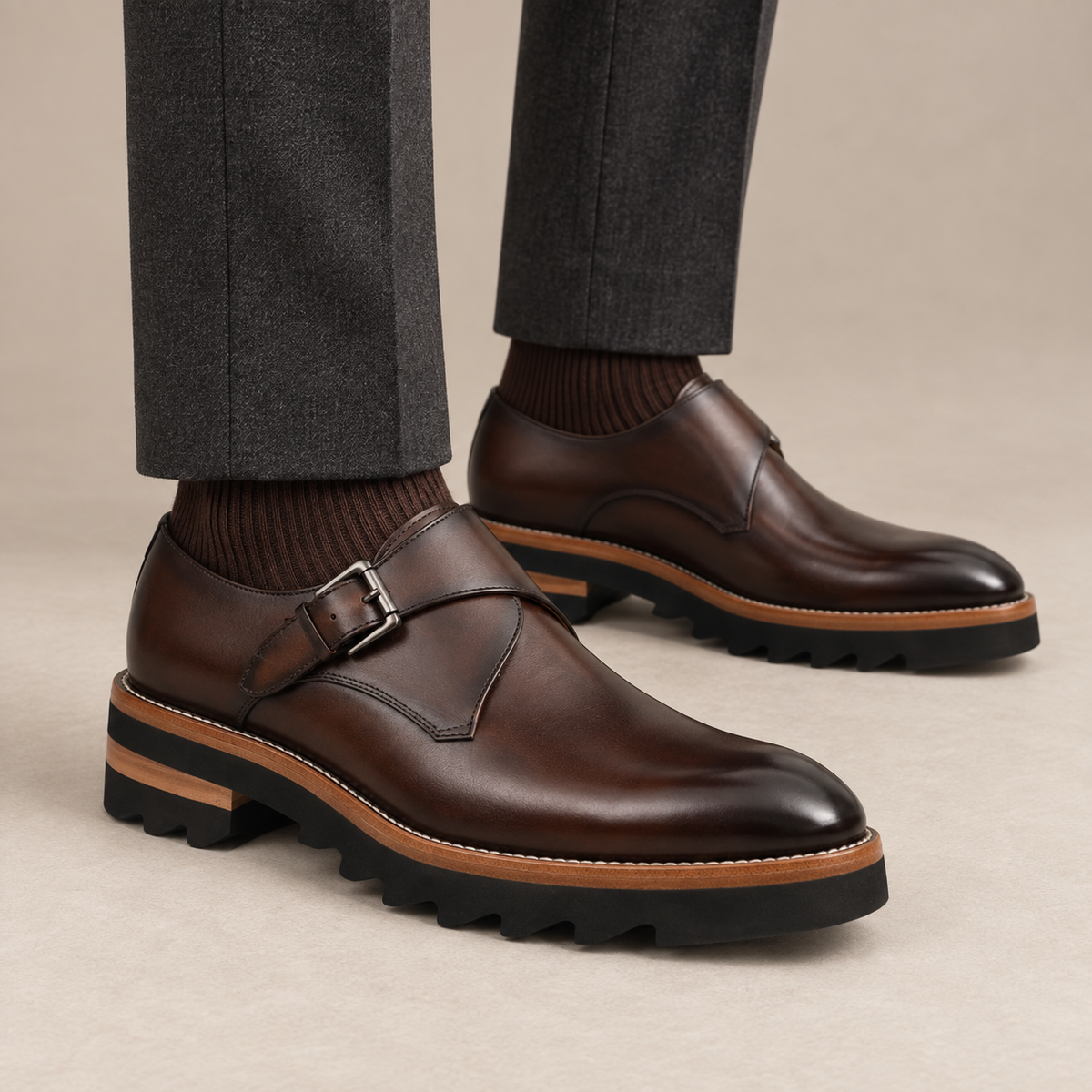 Dark brown glossy plain-toe monk-strap shoes — on-foot studio view