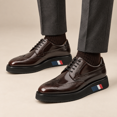 Dark brown platform wingtip Derby shoes — balanced premium on-foot studio view
